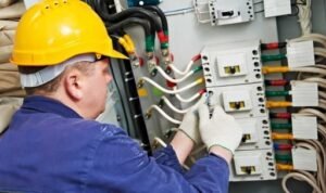 commercial electrician electrical service and maintenance repair on an industrial electrical panel
